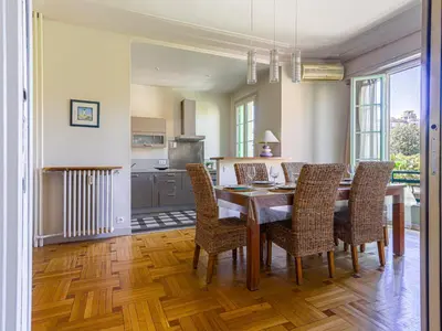a kitchen and dining room with a table and chairs at Apartment Le Victor Hugo by Interhome in Nice