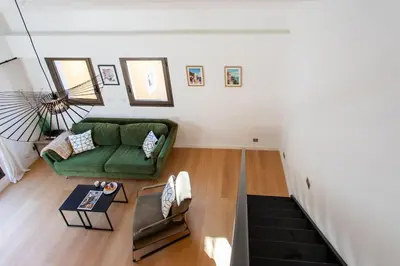 an overhead view of a living room with a green couch at #11 Alex suite terrace parking AC 2 BDR 5mins to sea in Saint-Jean-Cap-Ferrat