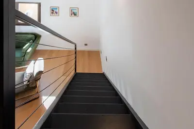 a staircase leading up to a room with a stair case at #11 Alex suite terrace parking AC 2 BDR 5mins to sea in Saint-Jean-Cap-Ferrat
