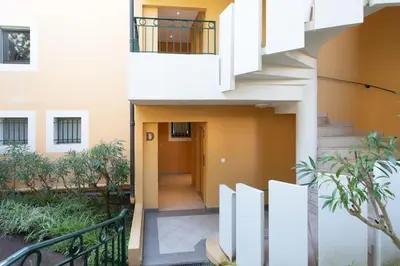a hallway of a building with a staircase at #11 Alex suite terrace parking AC 2 BDR 5mins to sea in Saint-Jean-Cap-Ferrat