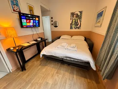 a bedroom with a bed with two towels on it at Peaceful Flat w WiFi Very Close to Pl Massena Refurbished in Nice