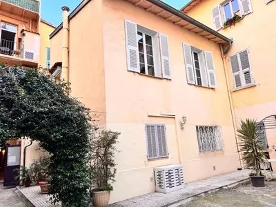 a building with windows and shutters on it at Peaceful Flat w WiFi Very Close to Pl Massena Refurbished in Nice