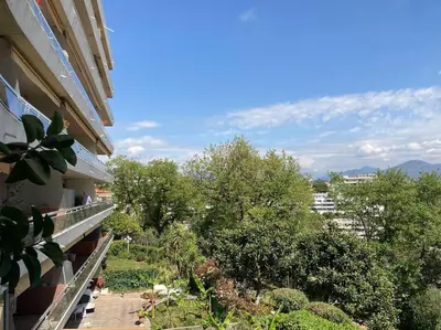a view from a balcony of a building with trees at Nice Absea Belles Terres 1 in Nice