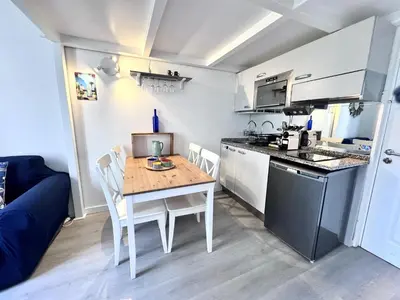 a kitchen with a granite counter top and a stove at NICE - Duplex Carré d'Or - 100m promenade des Anglais in Nice