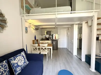 a small apartment with a loft bed and a dining room at NICE - Duplex Carré d'Or - 100m promenade des Anglais in Nice