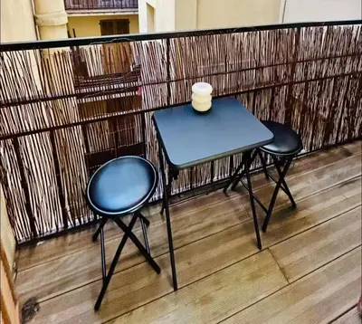 a small table and two chairs on a balcony at Sweet Home 1 ou Sweet Home 2 Réservez Sweet Home 1 ou Sweet Home 2 ou bien les deux in Nice