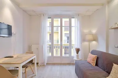 a living room with a couch and a table at 12 Trachel - T2 lumineux au coeur de Nice in Nice