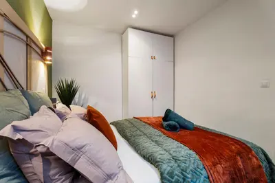 a bedroom with a bed with pillows at Nice Renting - 9b Massena - Chic Escape in the Heart of Nice Comfort & Charm ! in Nice