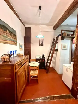 a kitchen with a wooden counter and a ladder at Abbaye - Appartement spacieux au coeur du Vieux-Nice in Nice