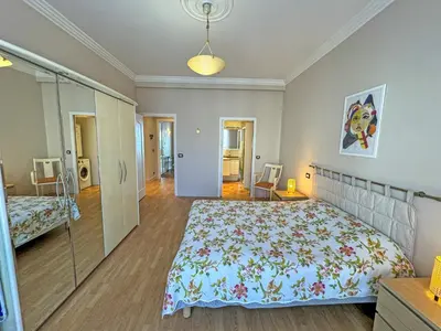 a bedroom with a large bed in a room at Cosy Sea Front Apartment Nice France in Nice