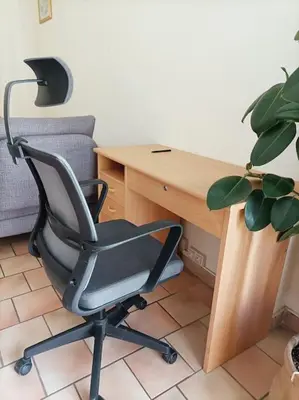 a desk with a chair next to a desk with a plant at Appartement quartier Libération in Nice