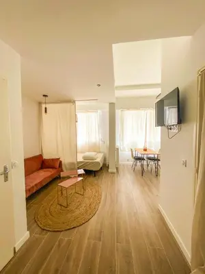 a living room with a couch and a table at Alsace Lorraine - Wifi, 3 pers, hyper centre in Nice