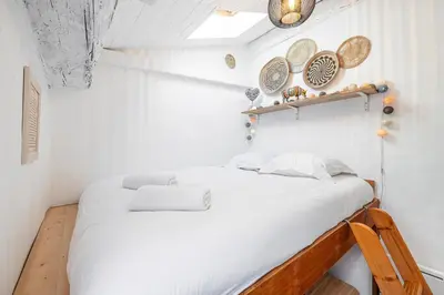 two beds in a small room with white walls at Quiet 1 Bdr at Nice Port in Nice