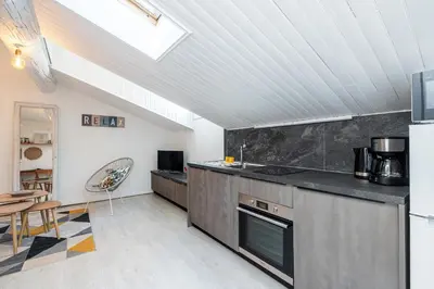 a kitchen with a sink and a stove top oven at Quiet 1 Bdr at Nice Port in Nice