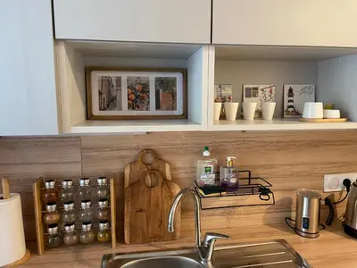 a kitchen with a sink and a counter top at Appartement à 1 min de la plage in Nice