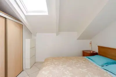 a bedroom with a bed and a skylight at 2P Carré d'Or, Nice hypercentre in Nice