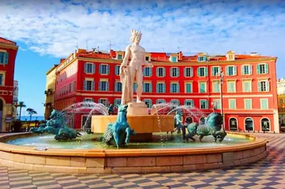 a fountain with a statue in front of a building at 2P Carré d'Or, Nice hypercentre in Nice