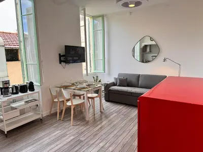 a living room with a couch and a table at Carre D'or: Very Central Calm Cozy 2BR, with Wi-Fi in Nice