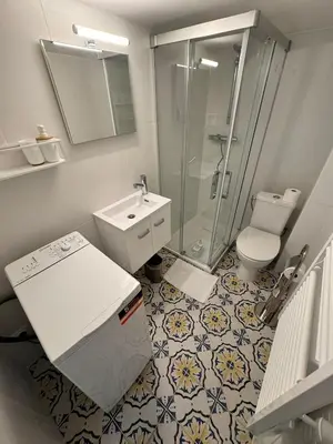 a bathroom with a shower and a sink and a toilet at Carre D'or: Very Central Calm Cozy 2BR, with Wi-Fi in Nice