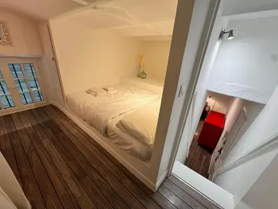 a small bedroom with a bed in a room at Carre D'or: Very Central Calm Cozy 2BR, with Wi-Fi in Nice