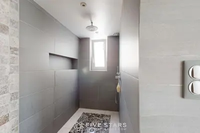 a bathroom with a shower with a glass door at Villa La Roche aux Mouettes FSHH in Nice