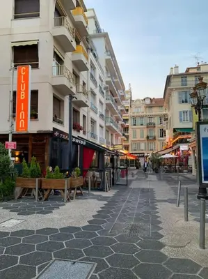 a street with benches and buildings in a city at ZEN & COSY - CARRÉ d'OR - Hyper centre - Plage in Nice