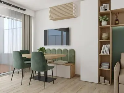 a dining room with a table and green chairs at ZEN & COSY - CARRÉ d'OR - Hyper centre - Plage in Nice