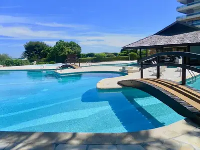 a large swimming pool with blue water at Nice Absea Belles Terres C in Nice