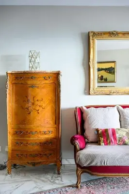 a room with a dresser and a chair and a mirror at Nice Absea Belles Terres C in Nice