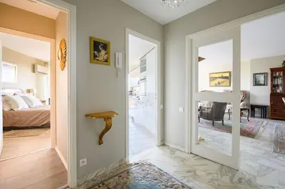 a hallway with a door leading to a bedroom at Nice Absea Belles Terres C in Nice