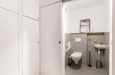 a bathroom with a toilet and a sink at Nice Absea Belles Terres in Nice