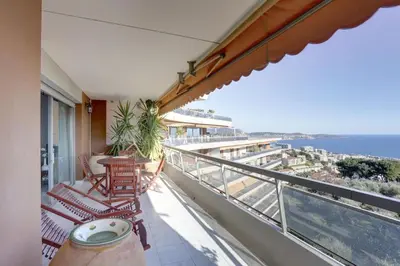 a balcony with chairs and a view of the ocean at Nice Absea Belles Terres 5 in Nice