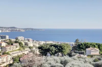 a view of a city with the ocean in the background at Nice Absea Belles Terres 5 in Nice