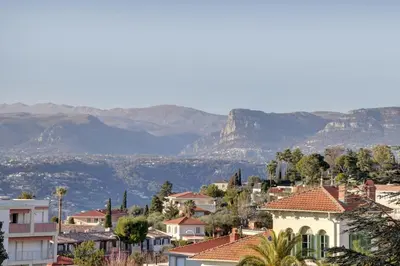 a city with houses and mountains in the background at Nice Absea Belles Terres 5 in Nice