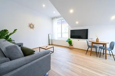 a living room with a couch and a table at Beau studio cozy centre ville et plages n13 in Nice