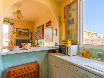 a kitchen with a counter with a microwave on it at Apartment L'Île de Beauté by Interhome in Nice