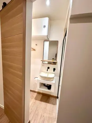 a bathroom with a sink and a mirror at Rue Droite - Studio cosy au coeur du Vieux-Nice in Nice