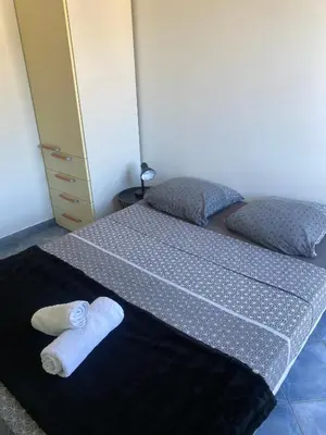 a bedroom with a bed with a towel on it at APPARTEMENT-NICE 01 VUE MER - PANORAMIQUE WIFI-Parking in Nice