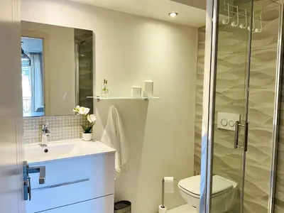 a bathroom with a toilet and a sink and a shower at Le Garib in Nice