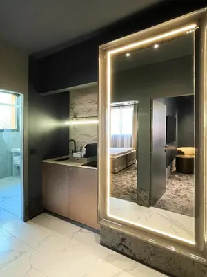 a black bathroom with a sink and a toilet at EZE BEACH Residence in Èze