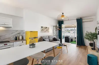 a kitchen and living room with a white counter top at Studio Californie FSHH in Nice
