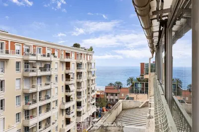 a view of the ocean from a building at Studio Californie FSHH in Nice