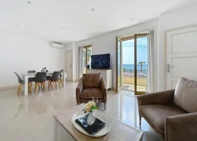 a living room with a couch and a table at Villa kriss in Nice