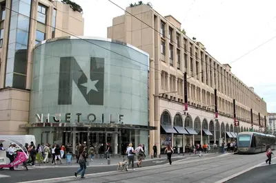 a busy city street with people walking in front of a building at Paradise Studio - Hyper Centre in Nice