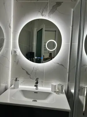 a white bathroom with a sink and a mirror at Paradise Studio - Hyper Centre in Nice