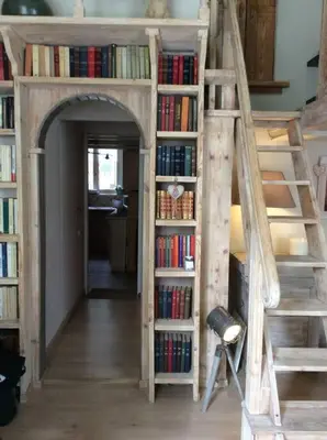 a room with a book shelf filled with books at Charming apartment in Beaulieu sur Mer in Beaulieu-sur-Mer