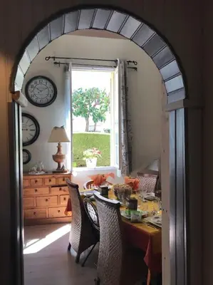 a dining room with a table and a window at Charming apartment in Beaulieu sur Mer in Beaulieu-sur-Mer