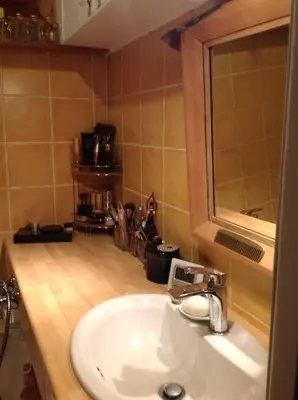 a bathroom with a sink and a mirror at Charming apartment in Beaulieu sur Mer in Beaulieu-sur-Mer