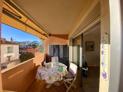 a small table on a balcony with a view at 2P Cagnes Sur Mer- Proximité Plage, Parking in Cagnes-sur-Mer