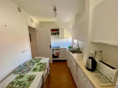 a kitchen with a sink and a counter top at 2P Cagnes Sur Mer- Proximité Plage, Parking in Cagnes-sur-Mer